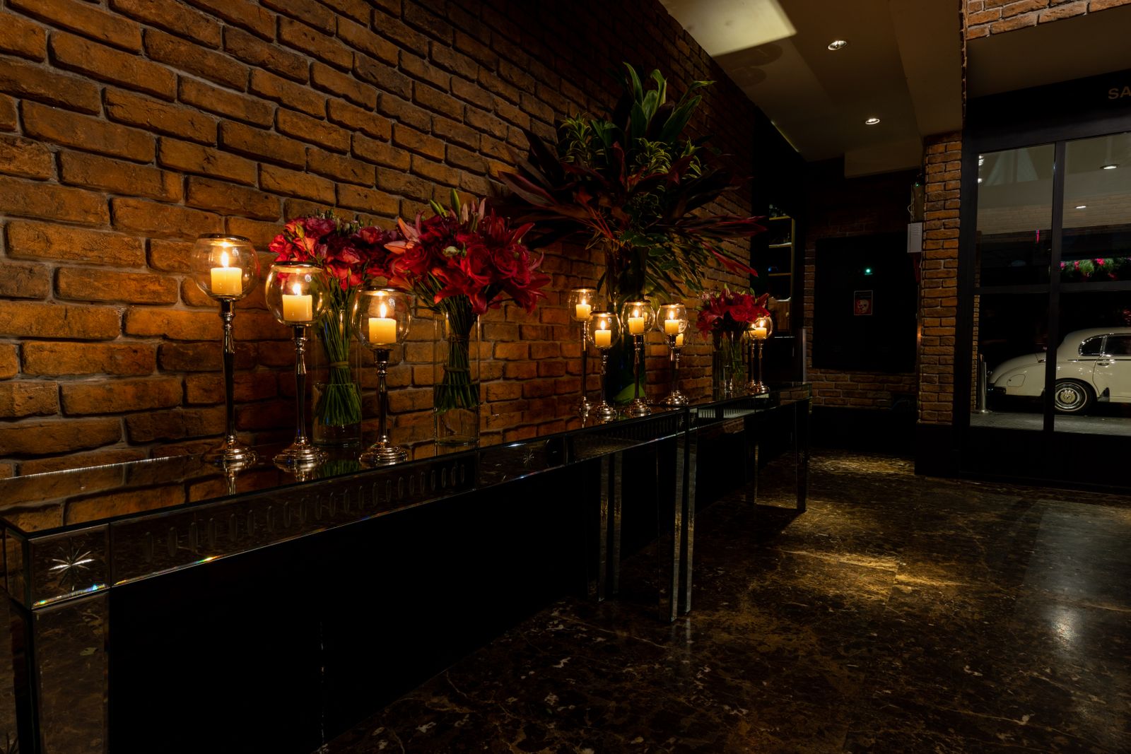 Illustrative candlelit hotel hallway, not the actual property