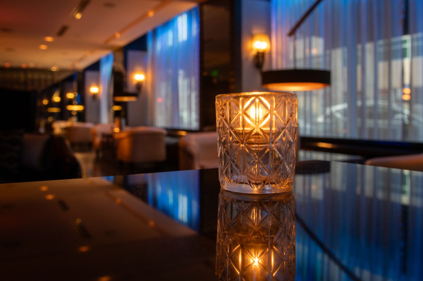 Illustrative hotel lounge with candlelit ambiance, not the actual property