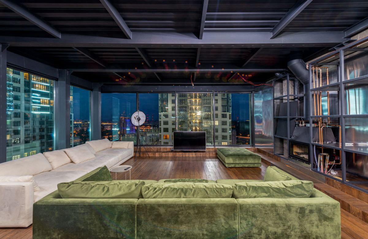 Illustrative top-floor residence with panoramic windows, not the actual property